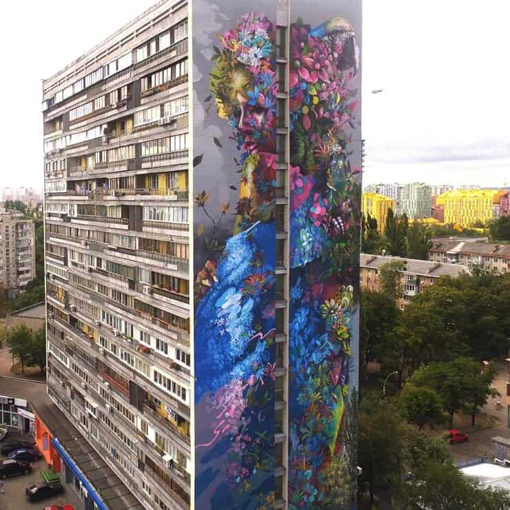 A mural painted on a tall apartment building